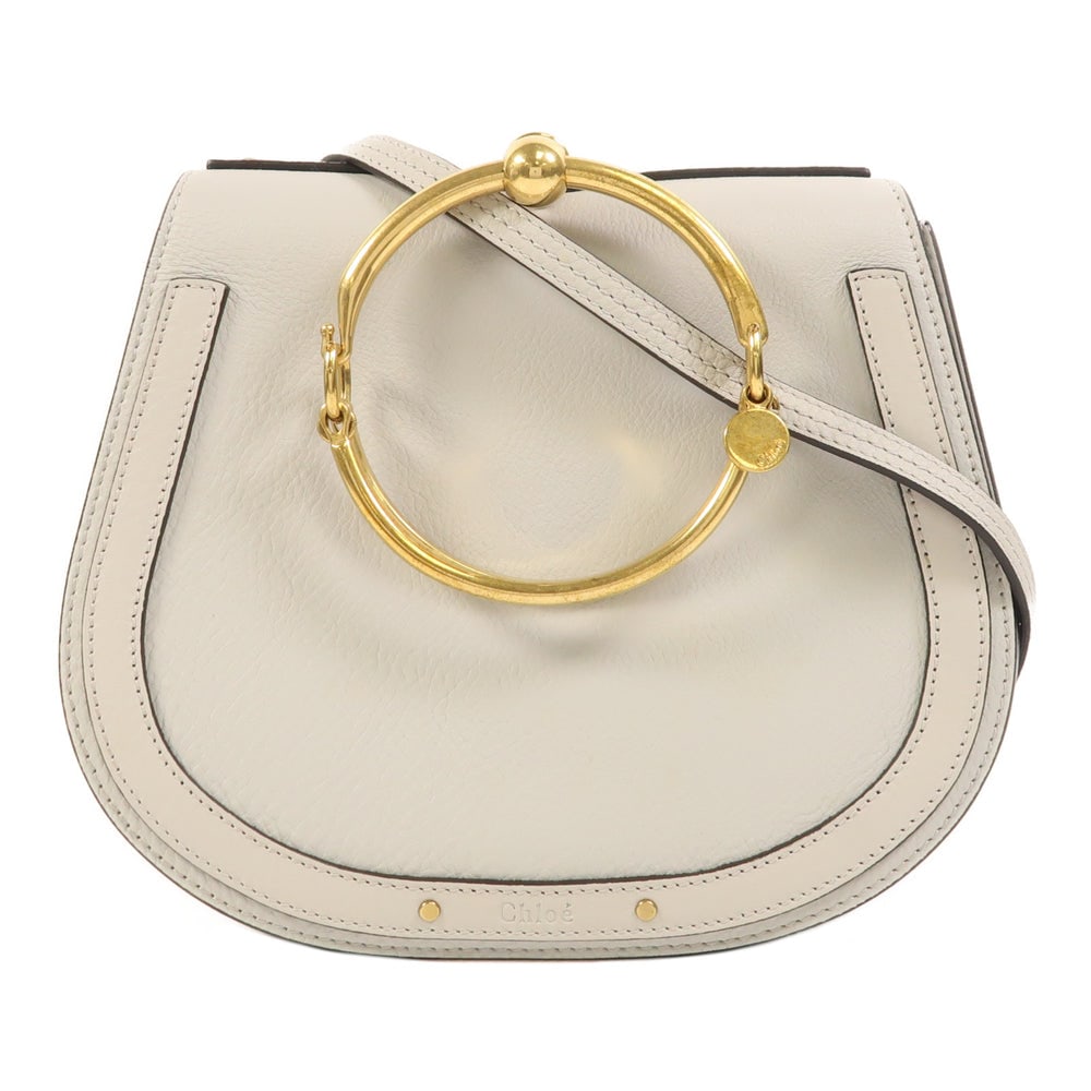 Chloe Nile Light Grey Shoulder Bag: Authentic and authenticated Chloe Nile shoulder bag in light grey calfskin. Product no. 02 18 70 65 7. Approx. 23.5W x 20.5H x 8D cm with 104.5-119.5 cm strap. Includes storage bags and shoulder