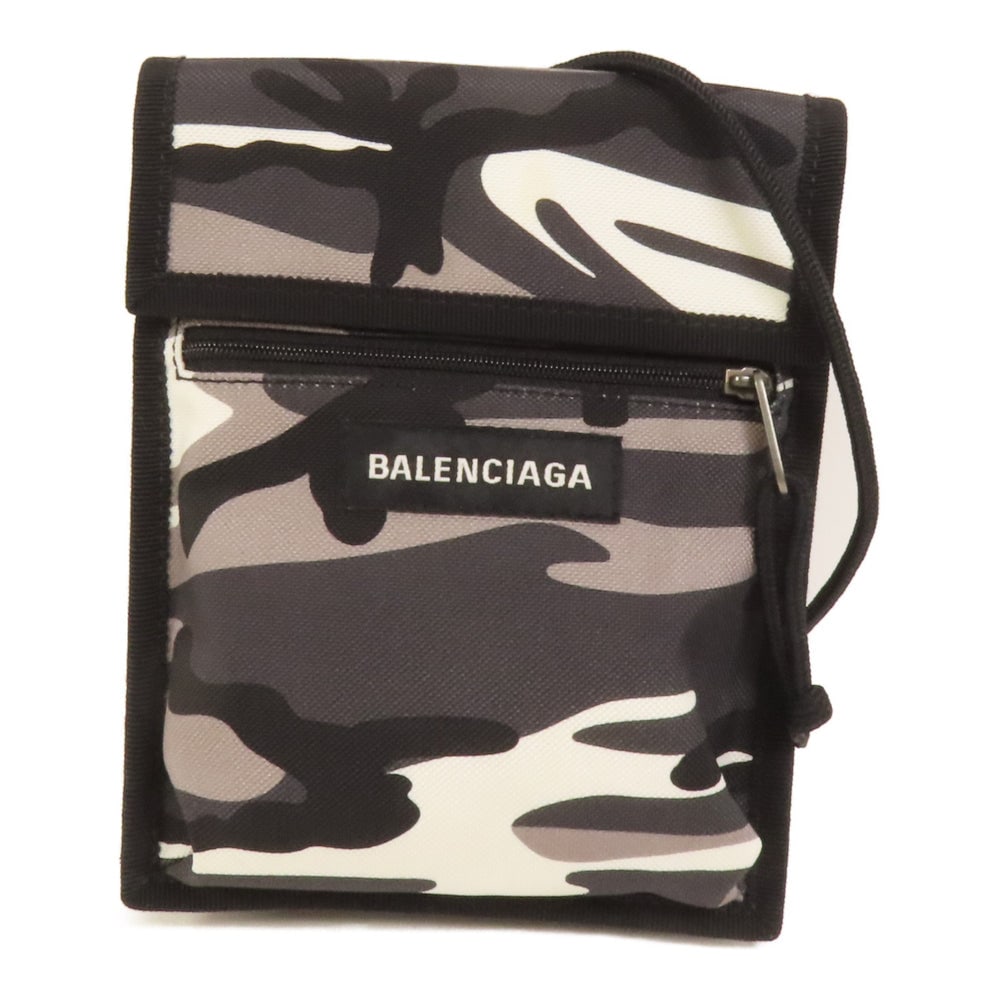 Balenciaga Canvas Shoulder Bag Black: Authentic and authenticated Balenciaga shoulder bag in black canvas. Product no. 1100.T.568008. Approx. 15W x 18H x 5D cm with 101 cm shoulder strap. Includes storage bags.