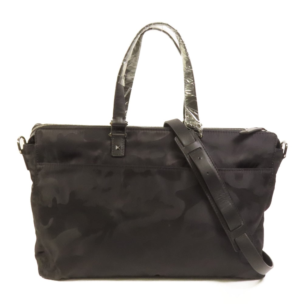 Valentino Camouflafe 2Way Bag: Black nylon 2Way shoulder bag. Includes storage bag and strap. 38 x 26 x 7 cm.