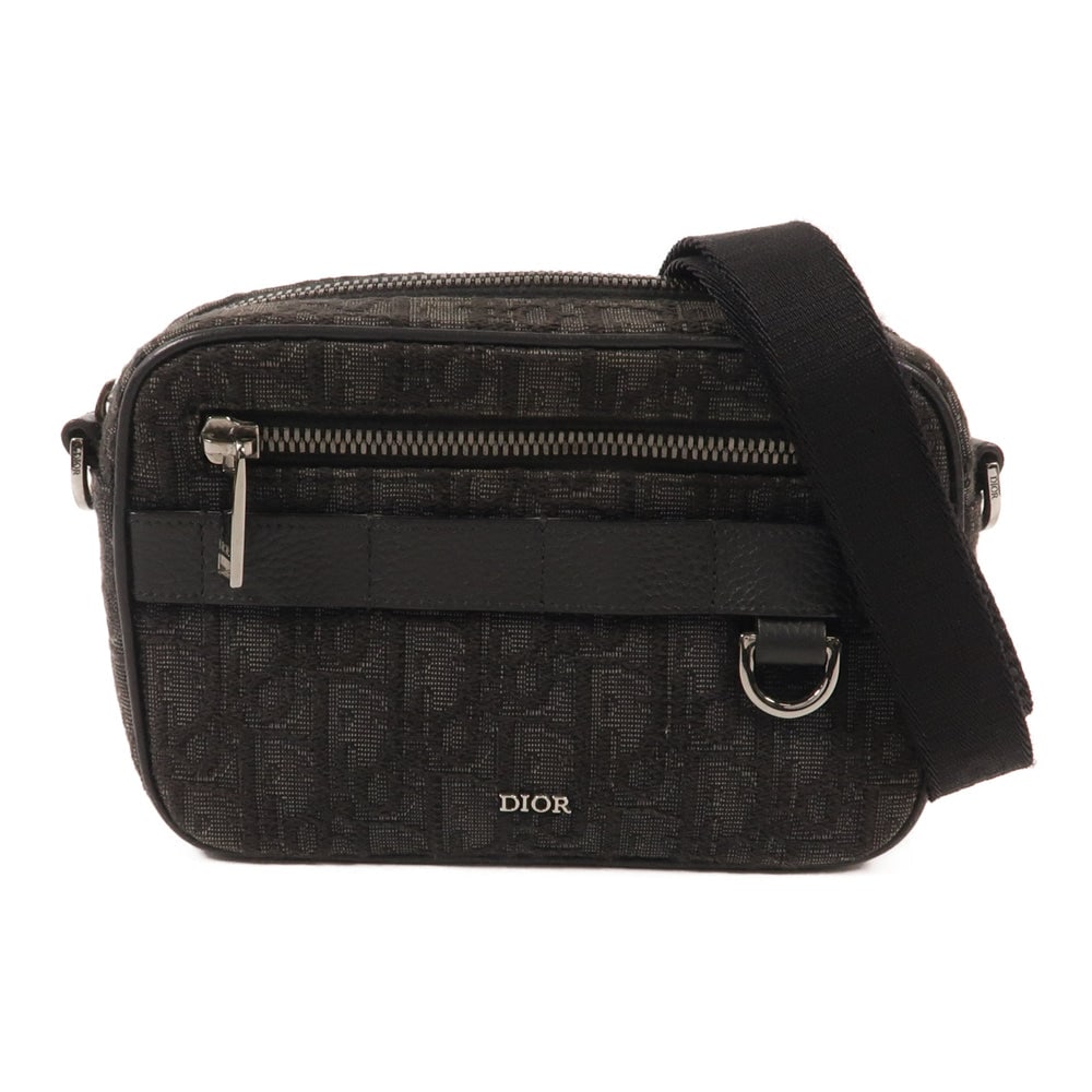 Dior Shoulder Bag Canvas Black: Black canvas Dior shoulder bag with storage bags and shoulder strap. Approx. 17.5 x 12 x 4.5 cm; strap 75-127 cm. Product no. 27-BO-1213. Authentic and authenticated.