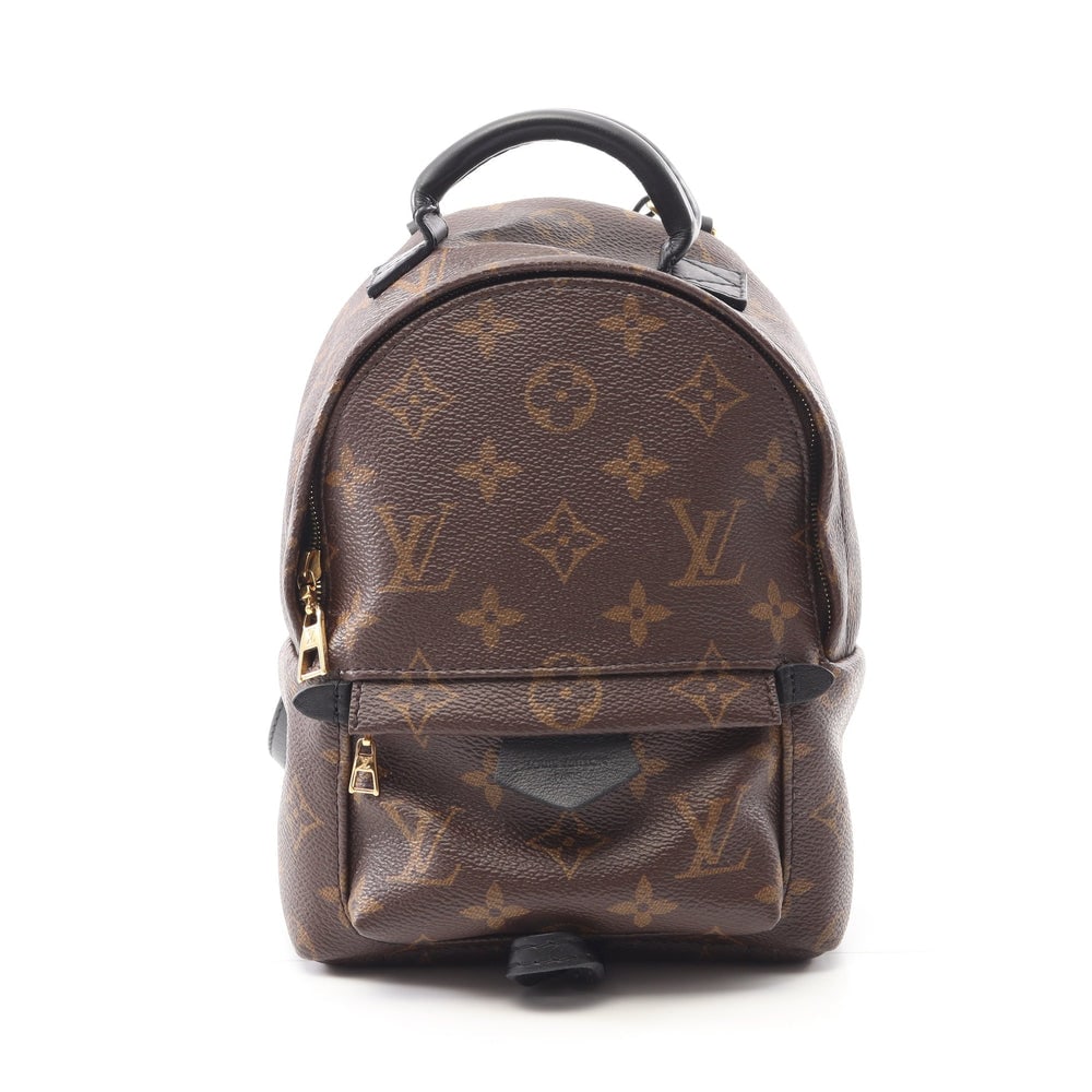 LV Palm Springs Mini Brown Black: Brown and black Monogram PVC leather Palm Springs Mini backpack. Approx. 16 x 21 x 8 cm; straps 92-116 cm; handle 14 cm. Model M41562, product no. AR5106. Authentic and authenticated.