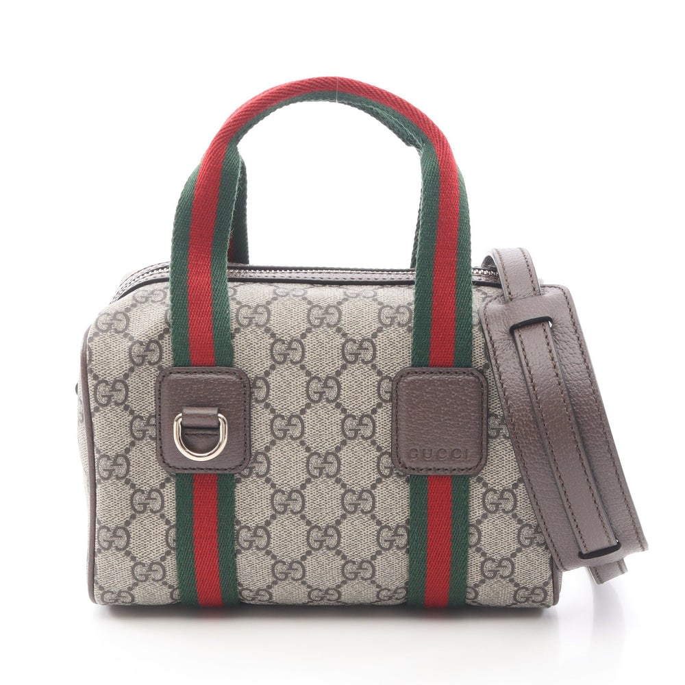Gucci Ophidia Mini Supreme Beige: Beige multicolor PVC leather Gucci Ophidia Mini GG Supreme 2-way handbag with storage bags and shoulder strap. Approx. 20 x 13 x 13 cm; handle 32 cm; strap 108-123 cm. Authentic and authenticated.