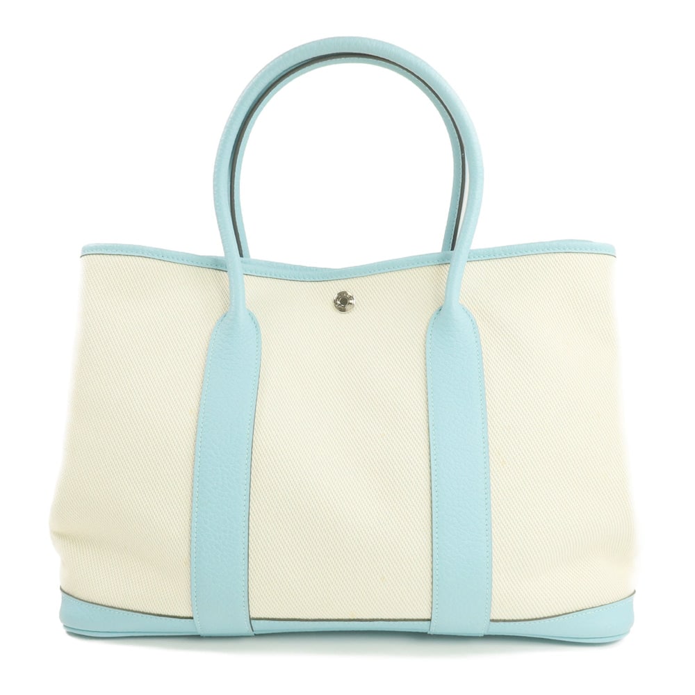 Hermes Garden Party PM Bleu Atoll: Bleu Atoll and beige Negonda leather and canvas Garden Party PM tote with storage bags. Approx. 36 x 26 x 17 cm; handle 44 cm. 2015 year noted. Authentic and authenticated.
