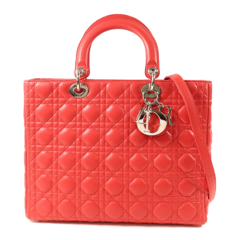 Dior Lady Dior 2-Way Red: Red lambskin Dior Lady Dior 2-way shoulder bag with storage bags, guarantee, and shoulder strap. Approx. 31.5 x 25 x 12 cm; handle 30 cm; strap 81 cm. Product no. 05MA0190. Authentic and