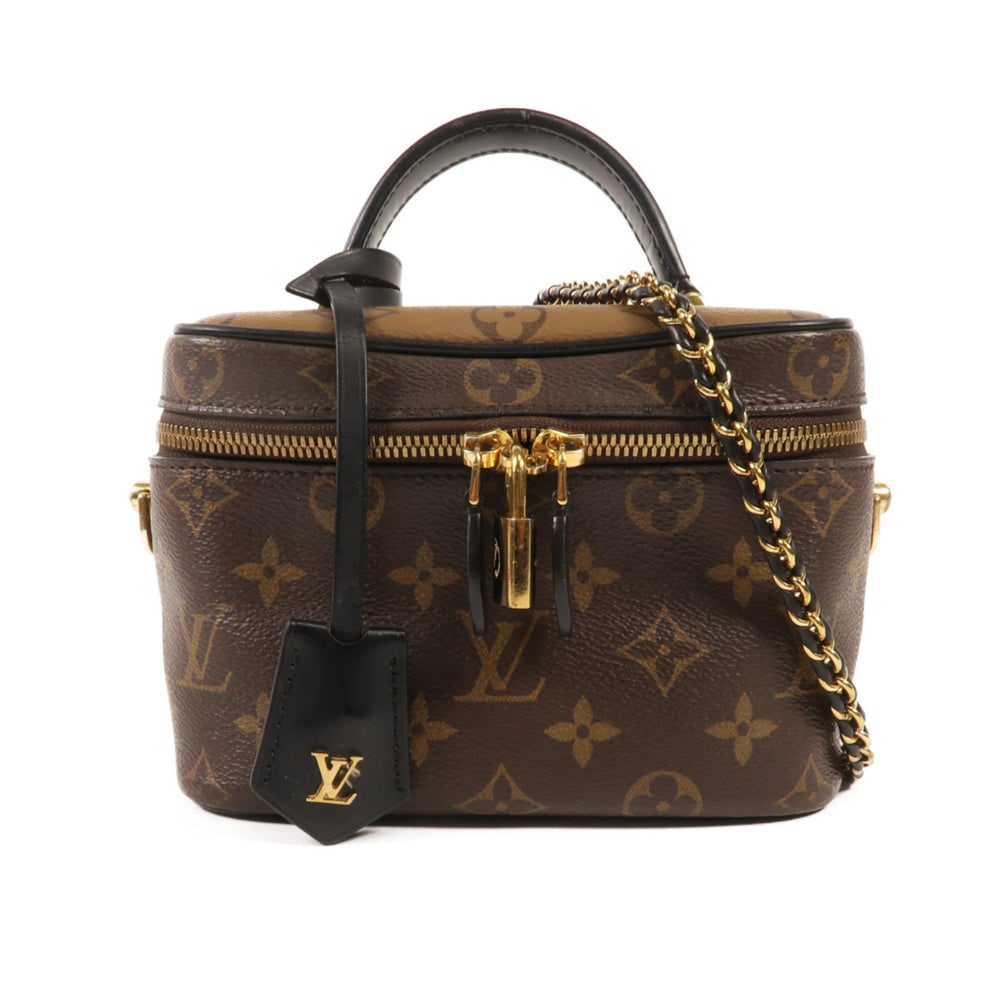 Louis Vuitton Vanity PM 2 Way: Brown monogram reverse PVC coated canvas vanity bag with GHW; includes poignet; W18 x H13 x D10.5 cm; handle 18 cm. Authentic and authenticated.