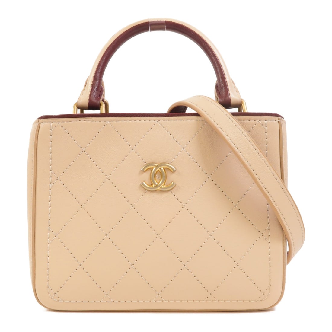 Chanel Shopping Tote Beige Burgundy: Beige calfskin 2-way shopping tote with gold-tone hardware.