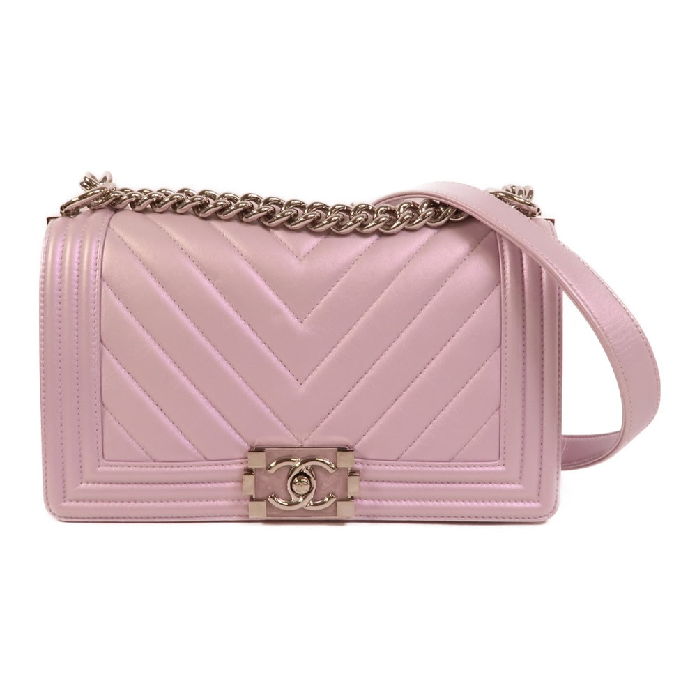 Chanel Boy 25 Purple: Purple lambskin Boy 25 chain shoulder bag with silver-tone hardware.