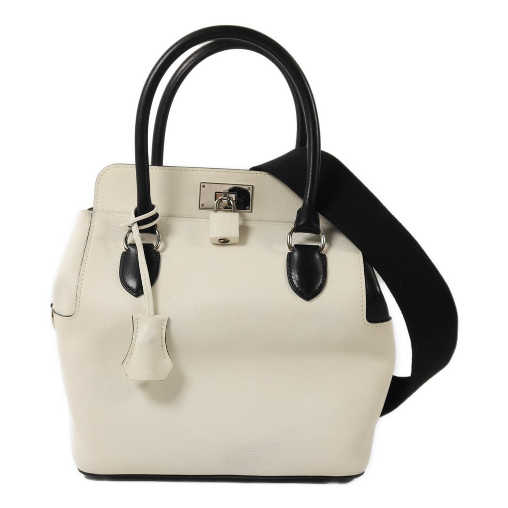 Hermes Toolbox 20 White Noir: White and noir Evercolor leather 2Way shoulder bag. Includes storage bag strap clochette key and cadena. 20 x 24 x 15 cm.