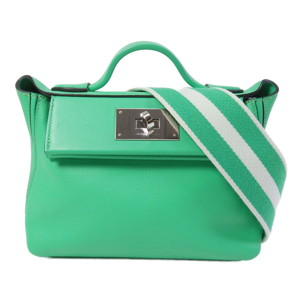 Hermes 24/24 Mini Vert Comic: Vert Comic Togo and Swift leather 2Way shoulder handbag. Includes storage bag and shoulder strap. 20.5 x 16 x 10.5 cm.