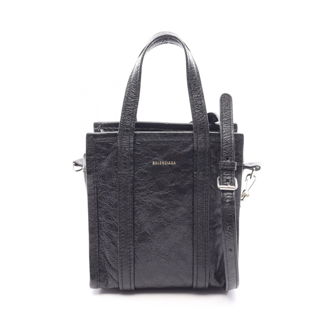 Balenciaga Bazar Shopper XXS Black: Authentic and authenticated Balenciaga Bazar Shopper XXS 2WAY handbag in black leather. Model 513988. Approx. 18H x 17W x 9D cm with 28 cm handle and 110-120 cm strap. Includes shoulder strap.