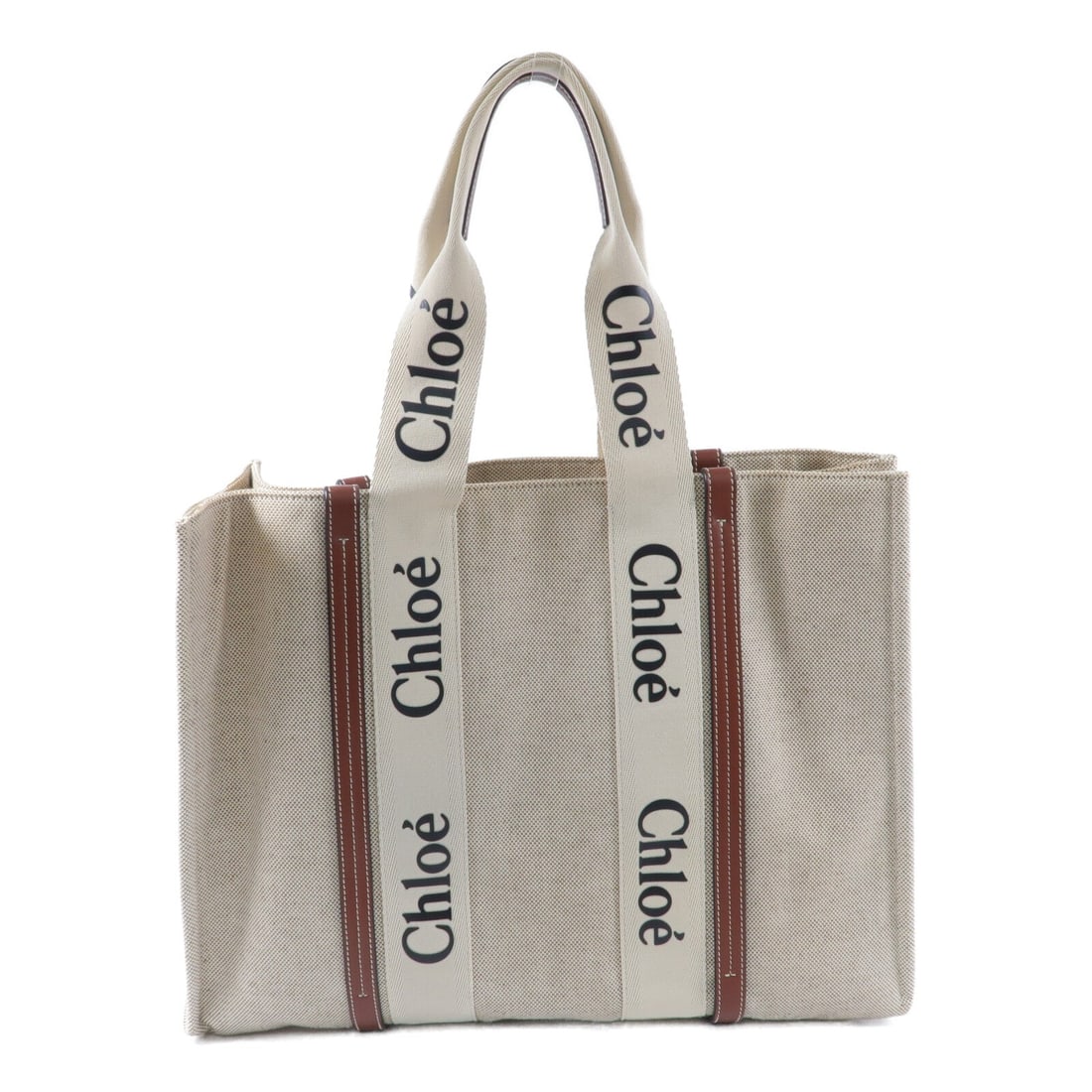 Chloe Woody Large Canvas Tote Beige: Authentic and authenticated Chloe Woody Large tote bag in beige canvas. Product no. 04217565. Approx. 43W x 32H x 11.5D cm with 51 cm handle. Includes storage bags.