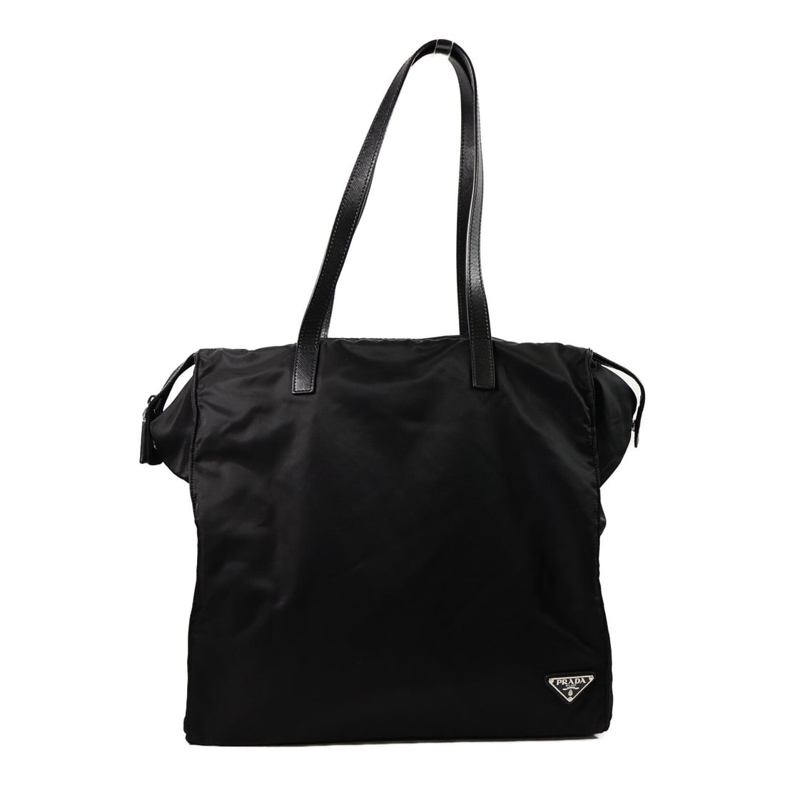 Prada Nylon Tote Bag Black: Authentic and authenticated Prada tote bag in black nylon. Product no. 8F. Approx. 37W x 38H x 20D cm with 59 cm handle. Includes storage bags and guarantee.
