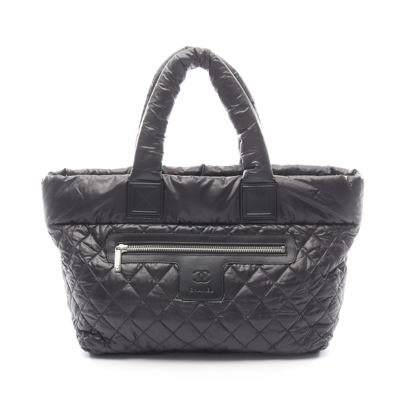 Chanel Coco Coon MM Tote Black: Authentic and authenticated Chanel Coco Coon MM tote handbag in black nylon and leather with silver hardware. Model A48611. Approx. 29H x 50/38W x 18D cm with 46 cm handle. Includes guarantee card