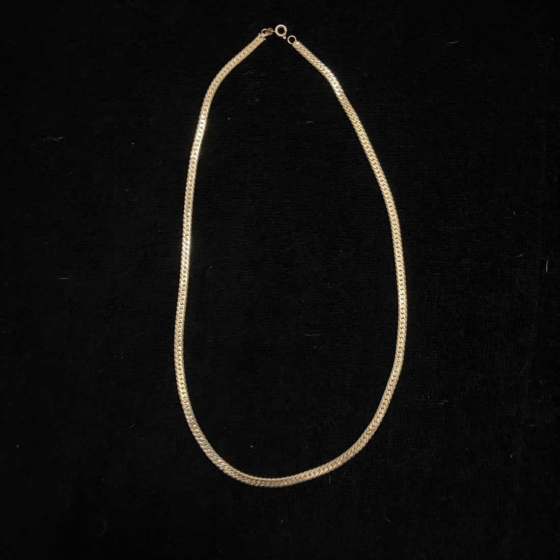 23" 14k Gold Filled Chain Necklace Approx. 25.9 g: 14k Gold Filled Chain Necklace with a spring ring clasp and an approximate 23-inch length. The necklace weighs 25.9 grams as shown in the provided scale image. A small tag near the clasp appears to