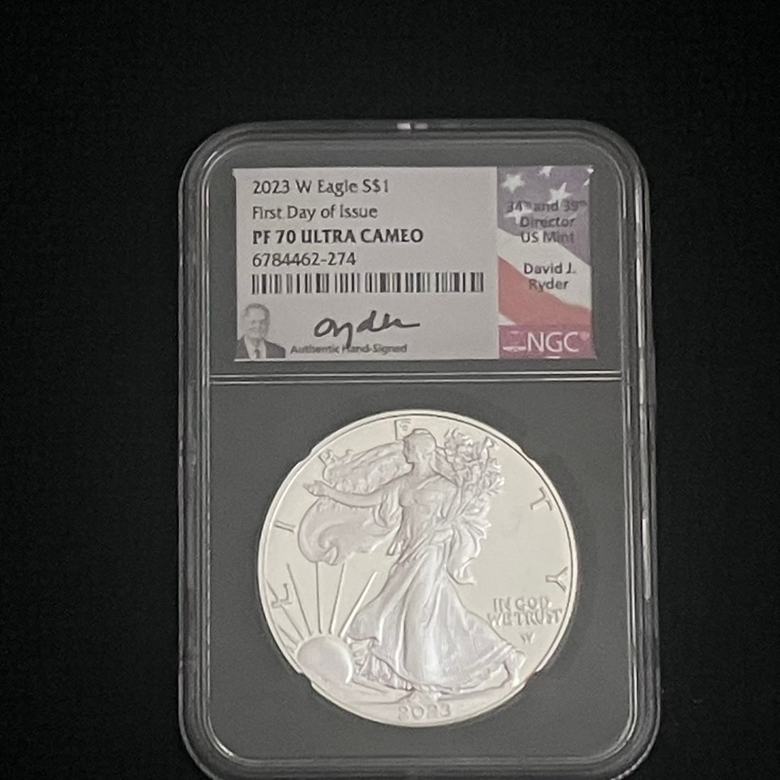 2023-W Silver Eagle Proof NGC PF70 UCAM: Encapsulated 2023-W American Silver Eagle proof one-dollar coin in an NGC holder. Label indicates First Day of Issue, PF70 Ultra Cameo grade, certification number 6784462-274, and an authentic