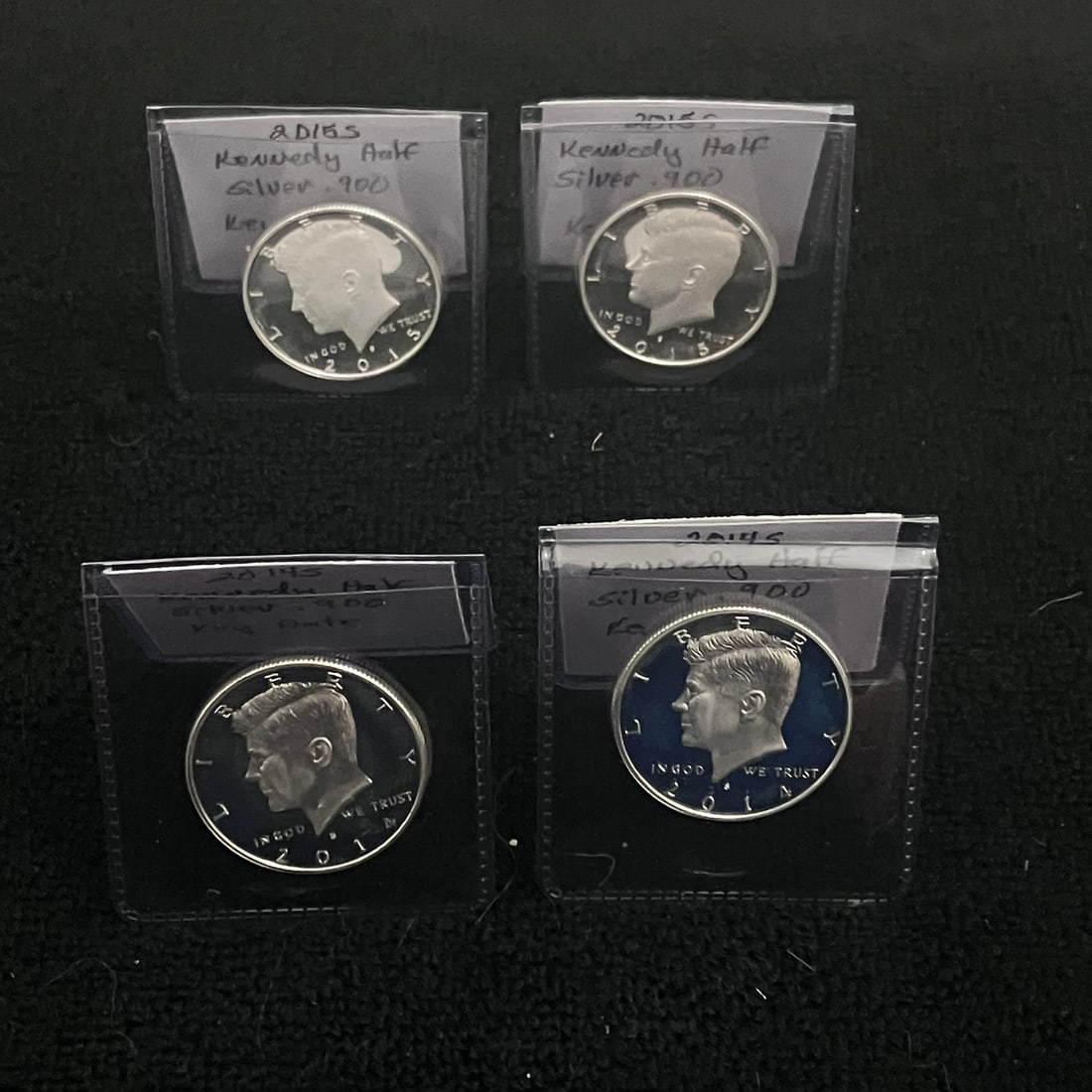 4 - Kennedy .90 Silver Half Dollar Cameo Proof: (2) 2014-S & (2) 2015-S Kennedy half dollar shown in a plastic flip. Obverse with Kennedy portrait, “LIBERTY,” “IN GOD WE TRUST,” date 2014 & 2015, and visible S mint mark. Reverse wit