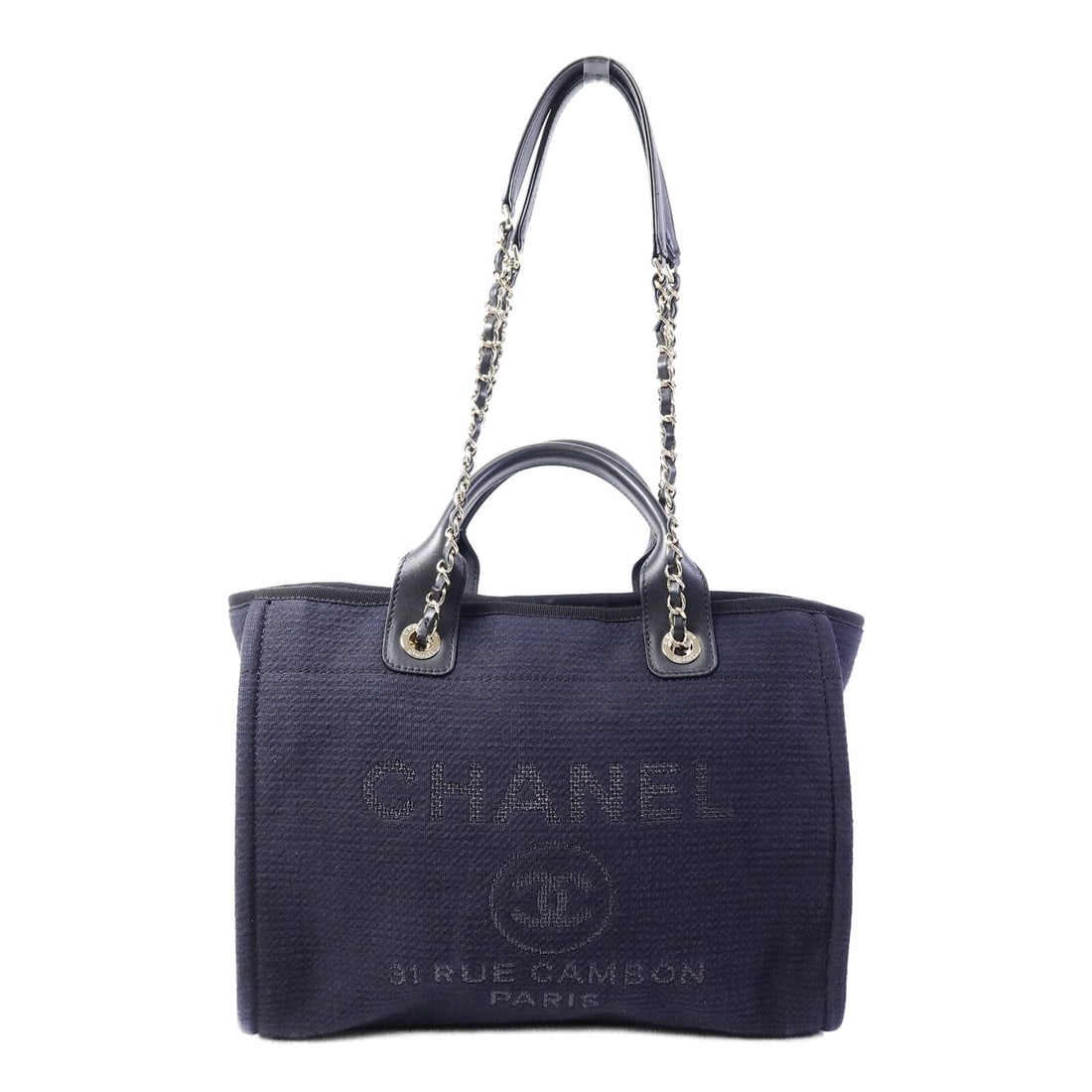 Chanel Deauville Tote Denim Navy: GHW. Navy Deauville tote bag in denim. Accessories: storage bags, pouch. Product no.: AT8CHG4A. Size: W34.5 x H27.5 x D13 cm; handle 30 cm; shoulder max 74 cm.