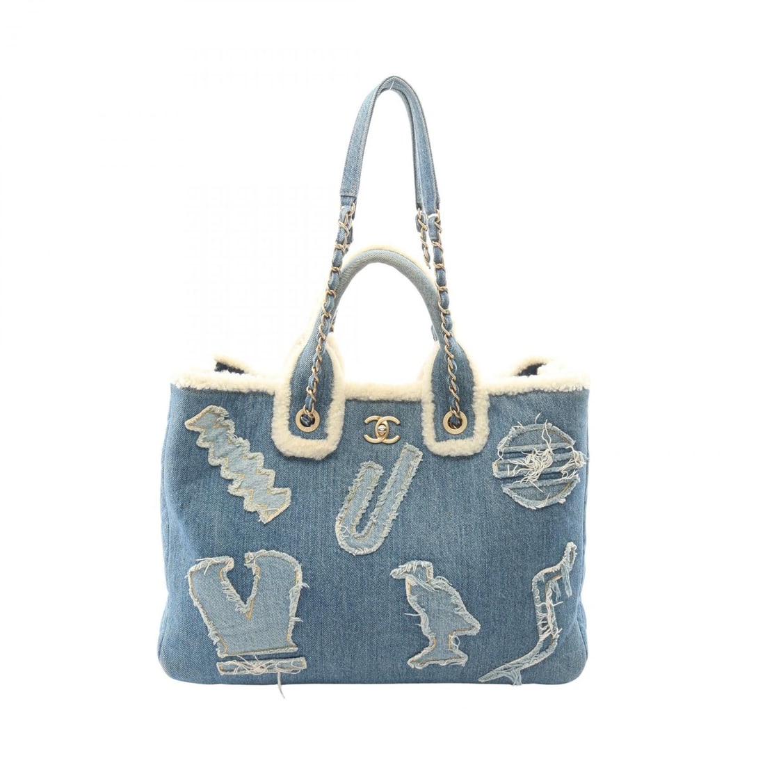 Chanel Large Shopping Denim Blue: Denim and mouton 2 way chain shoulder tote in blue and white with GHW. Includes serial seal. H 30 cm; W 40 cm; D 15.5 cm; strap 63 cm; handle 31 cm; strap drop 26 cm.