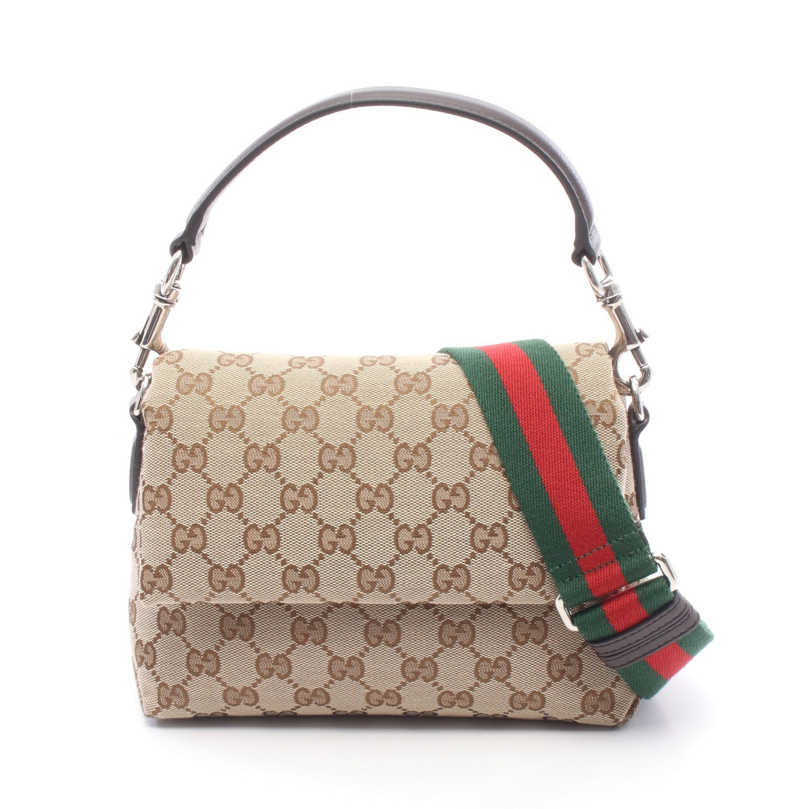 Gucci GG Canvas Sherry 2 Way: Canvas leather 2 way handbag in beige and dark brown. Includes shoulder strap. H 16 cm; W 21 cm; D 7 cm; strap 93-133 cm; handle 34 cm.