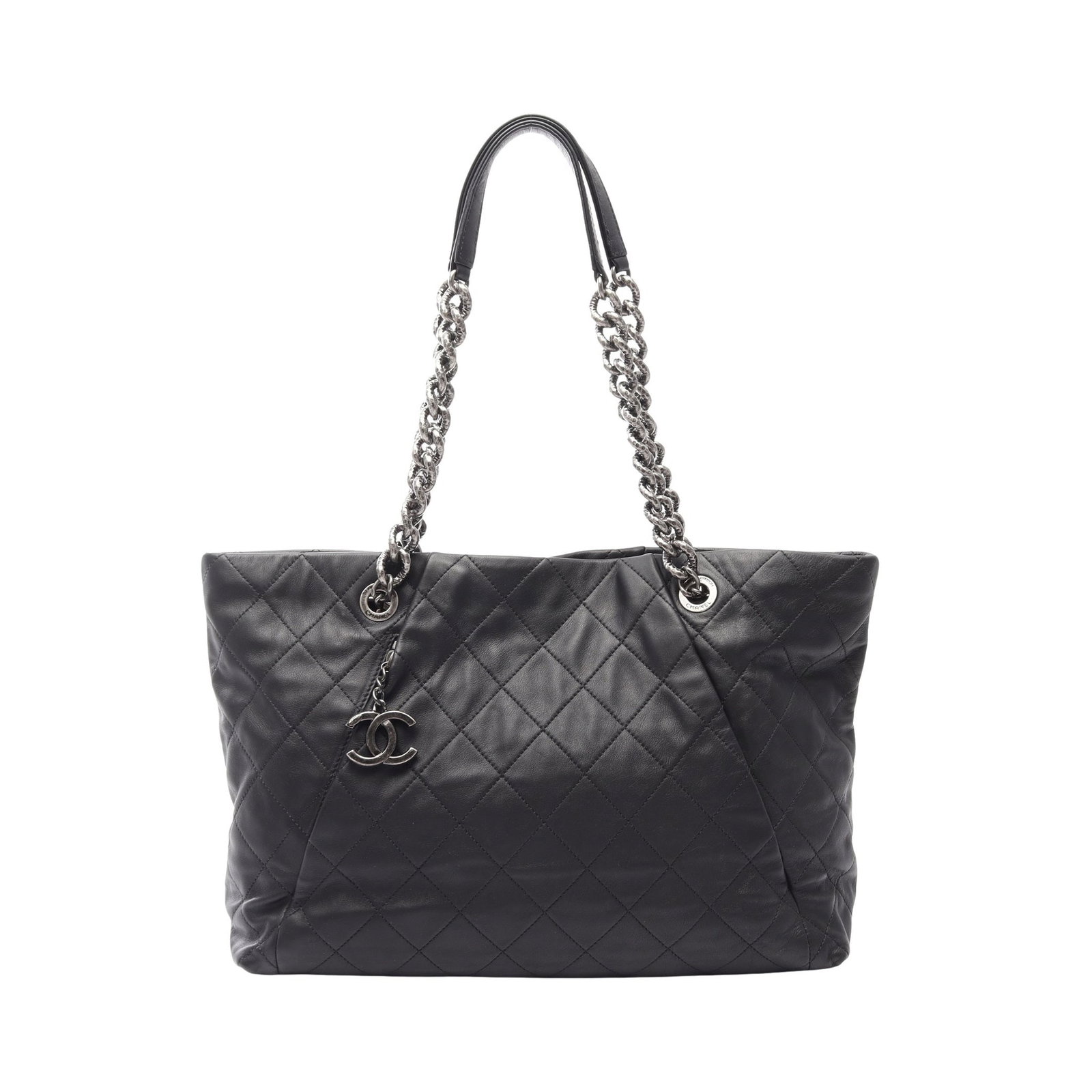 Chanel Chain Tote Black Lambskin: Black lambskin matelasse chain shoulder tote with antique silver hardware. Includes guarantee card and serial seal. Size 26 x 39/35 x 13 cm, strap 60 cm, max drop 23 cm.