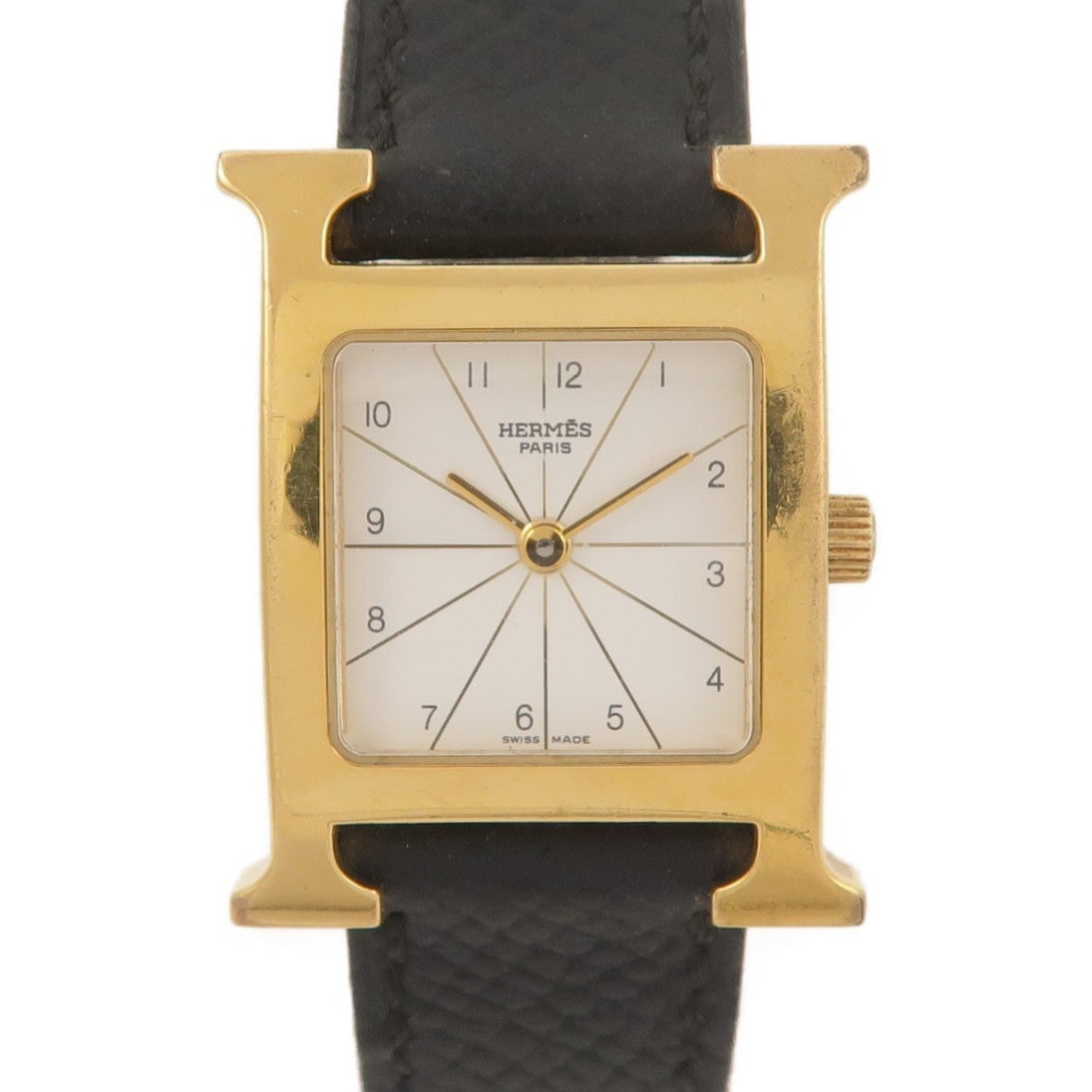 Hermes H Watch Quartz Gold Plated White: Quartz watch in gold plated metal, white / white color. Accessories: none. Case length 30mm; case side 21mm; max arm circumference 16.5cm; band width 13-16mm.