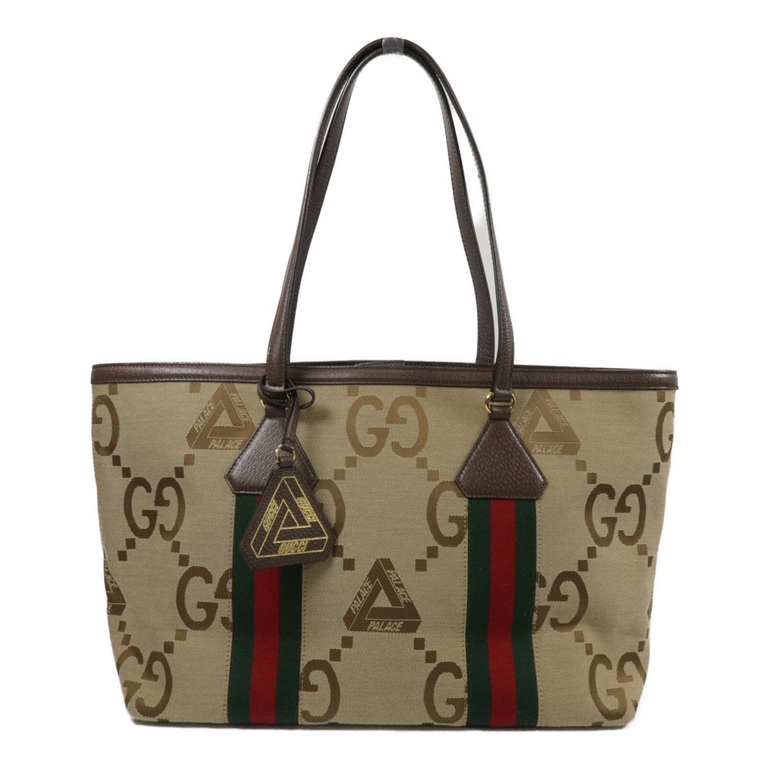 Gucci x Palace Medium Tote: Beige PVC coated canvas Gucci x Palace Medium tote with gold hardware. Includes storage bags. Size 37 x 26 x 13 cm, handle 54 cm.