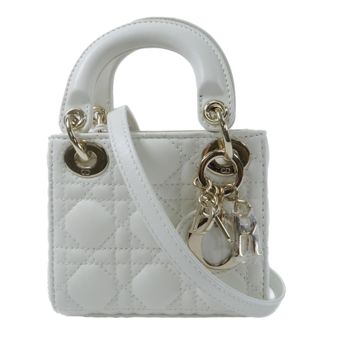 Dior Micro Lady Dior White: White lambskin Micro Lady Dior 2 way shoulder bag with gold hardware. Includes storage bags, guarantee and shoulder strap. Size 12 x 10.5 x 5 cm, handle 19 cm, shoulder 92 to 107 cm.