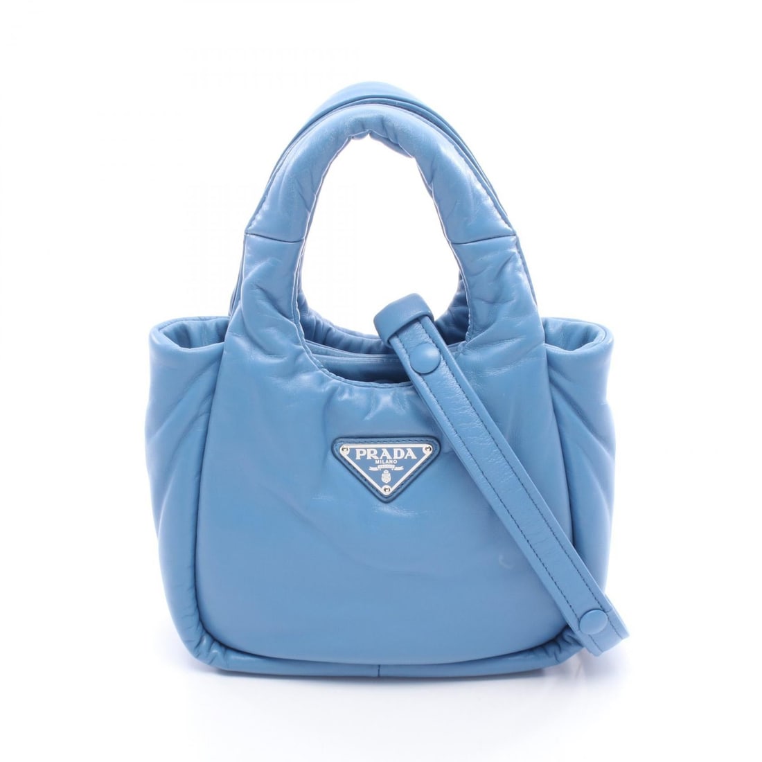 Prada Padded 2 Way Blue Leather: Blue Padded 2 way handbag in leather. Size: W19 x H15 x D8.5 cm. Handle 28 cm. Shoulder 105-115 cm. Includes shoulder strap.