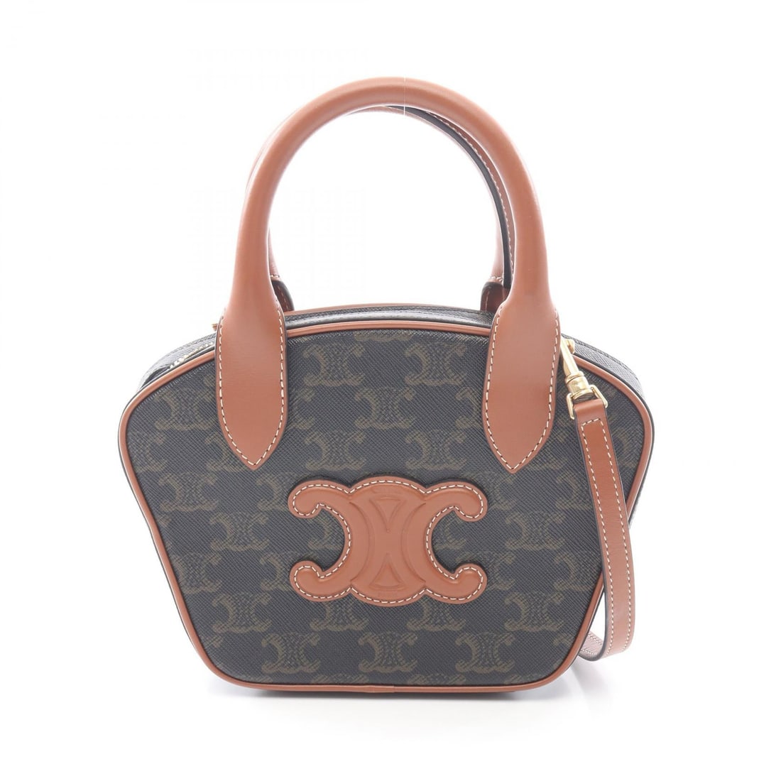 Celine Triomphe 2 Way Bag Black Brown: 2 way handbag in black and brown PVC coated canvas with leather trim. Size: W13.5 x H15 x D5 cm. Handle 25 cm. Shoulder 97-115 cm. Includes shoulder strap.