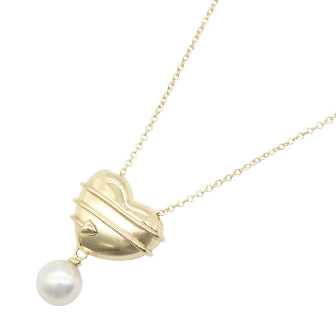 Tiffany Heart Arrow Pearl Necklace Gold: Heart and Arrow Pearl necklace in K18 yellow gold with pearl. Includes storage box. Neck size 41cm. Motif 15mm wide x 21mm high. Weight 7.1g.
