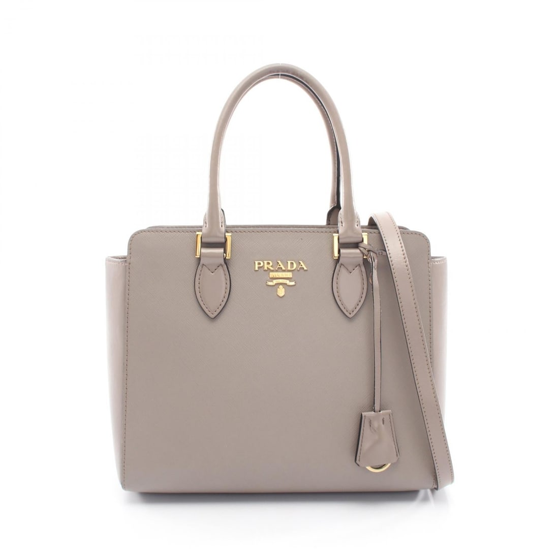 Prada 2 Way Handbag Beige Leather: Beige leather 2 way handbag. Size: W26 x H21 x D9 cm. Handle 38 cm. Shoulder 113-123 cm. Includes shoulder strap.