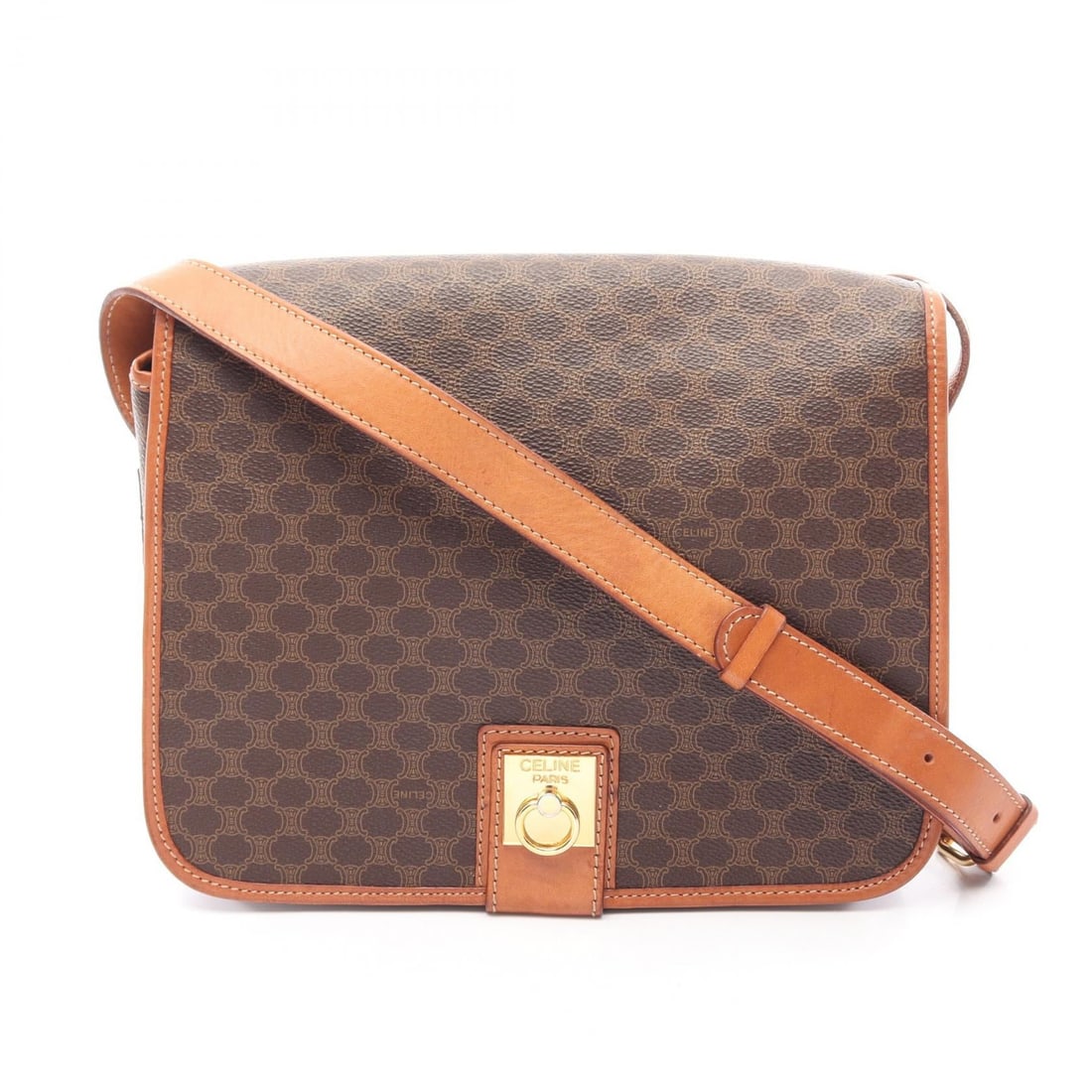 Celine Macadam Shoulder Brown Canvas: Macadam shoulder bag in brown PVC coated canvas with leather trim. Size: W25 x H20 x D7 cm. Shoulder 113-121 cm.