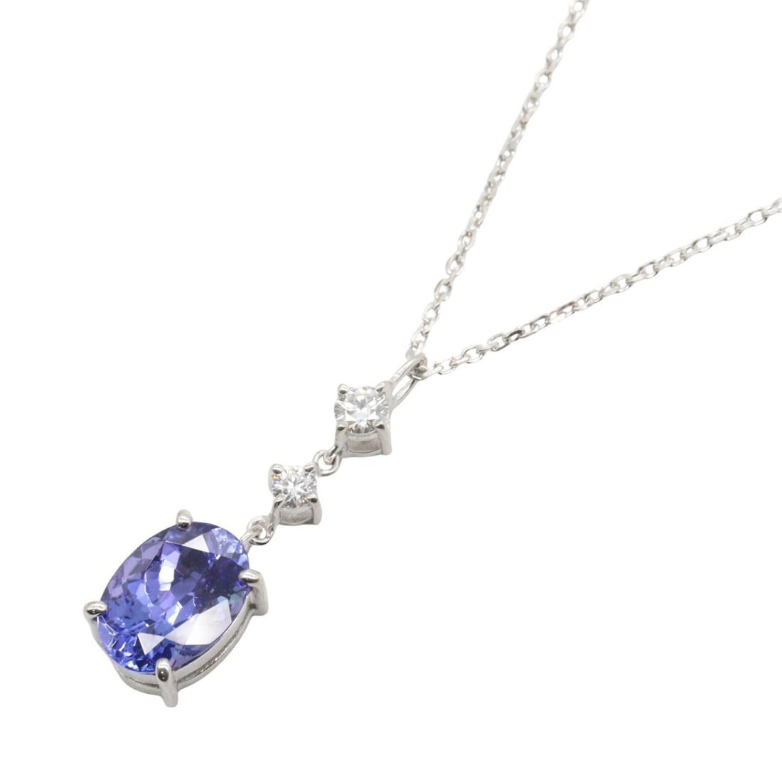 Tanzanite Diamond Necklace 18K WG: Tanzanite and diamond necklace in K18WG white gold. Neck size 45cm. Motif 5mm wide x 18mm high. Weight 3.0g.