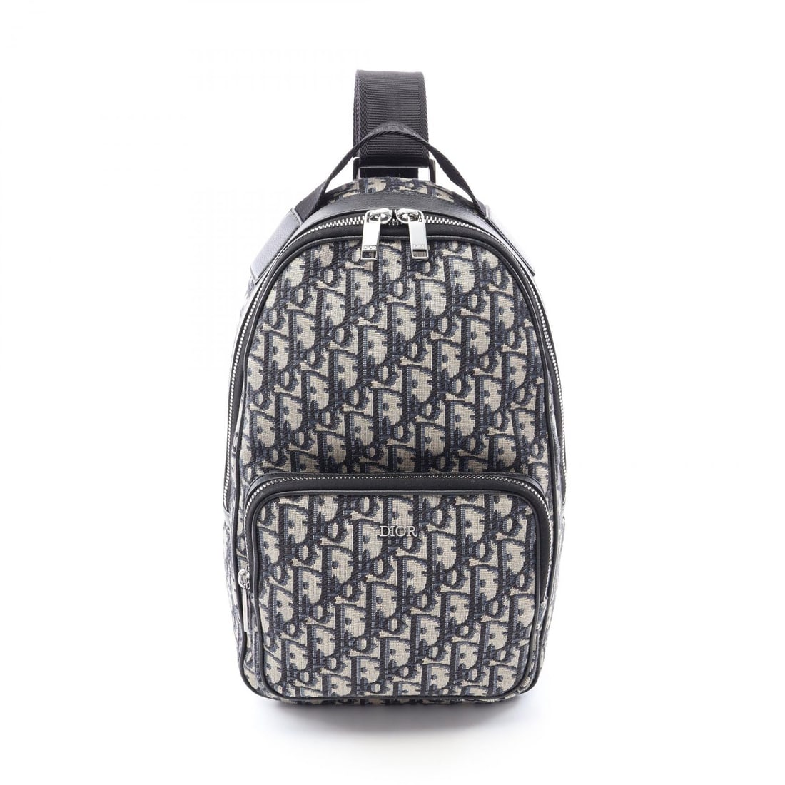 Dior Rider Sling Bag Navy Beige: Rider Sling Bag Oblique waist bag body bag in navy beige and black canvas with leather trim. Size: W21 x H32 x D9 cm. Handle 15 cm. Shoulder 65-111 cm.