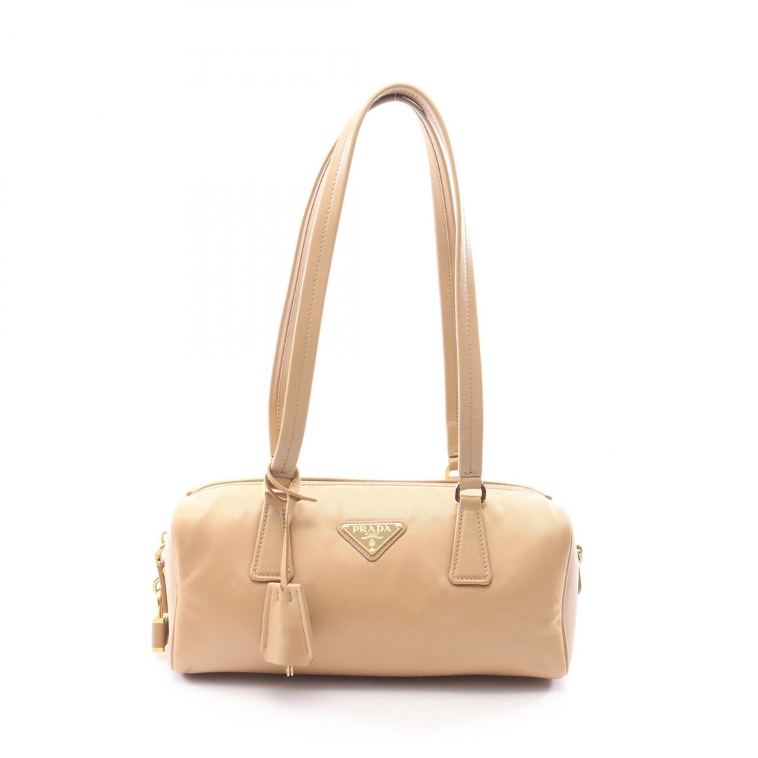 Prada Re-Nylon Top Handle Beige: Re-Nylon Medium Top Handle shoulder bag in beige nylon and leather. Size: W29 x H12 x D10 cm. Shoulder 63 cm. Includes clochette key and padlock.