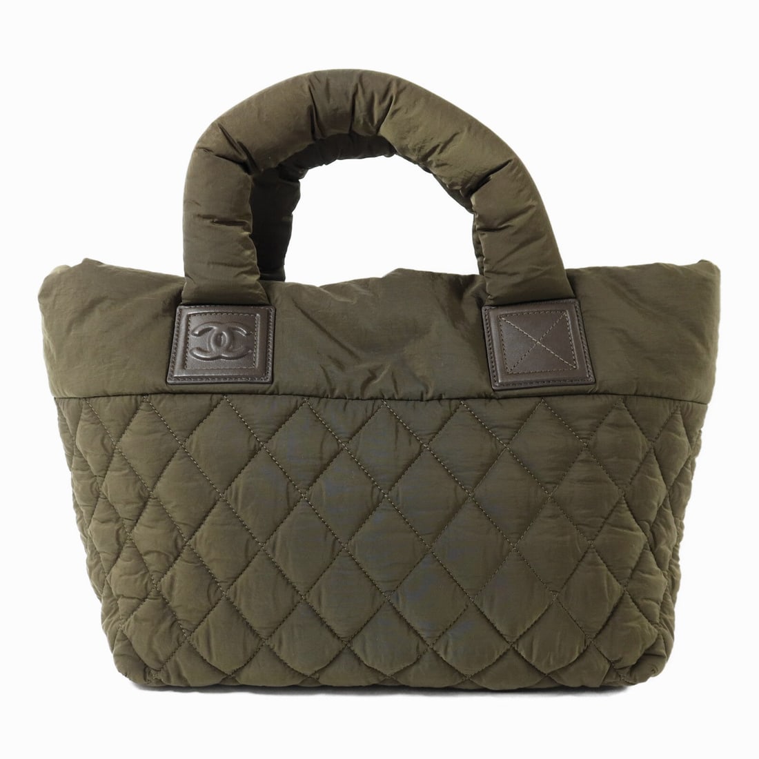 Chanel CC SHW Coco Cocoon Green: CC SHW Coco Cocoon handbag in green nylon. Size: W29 x H25 x D13 cm. Handle 38 cm. Includes hologram sticker and guarantee.