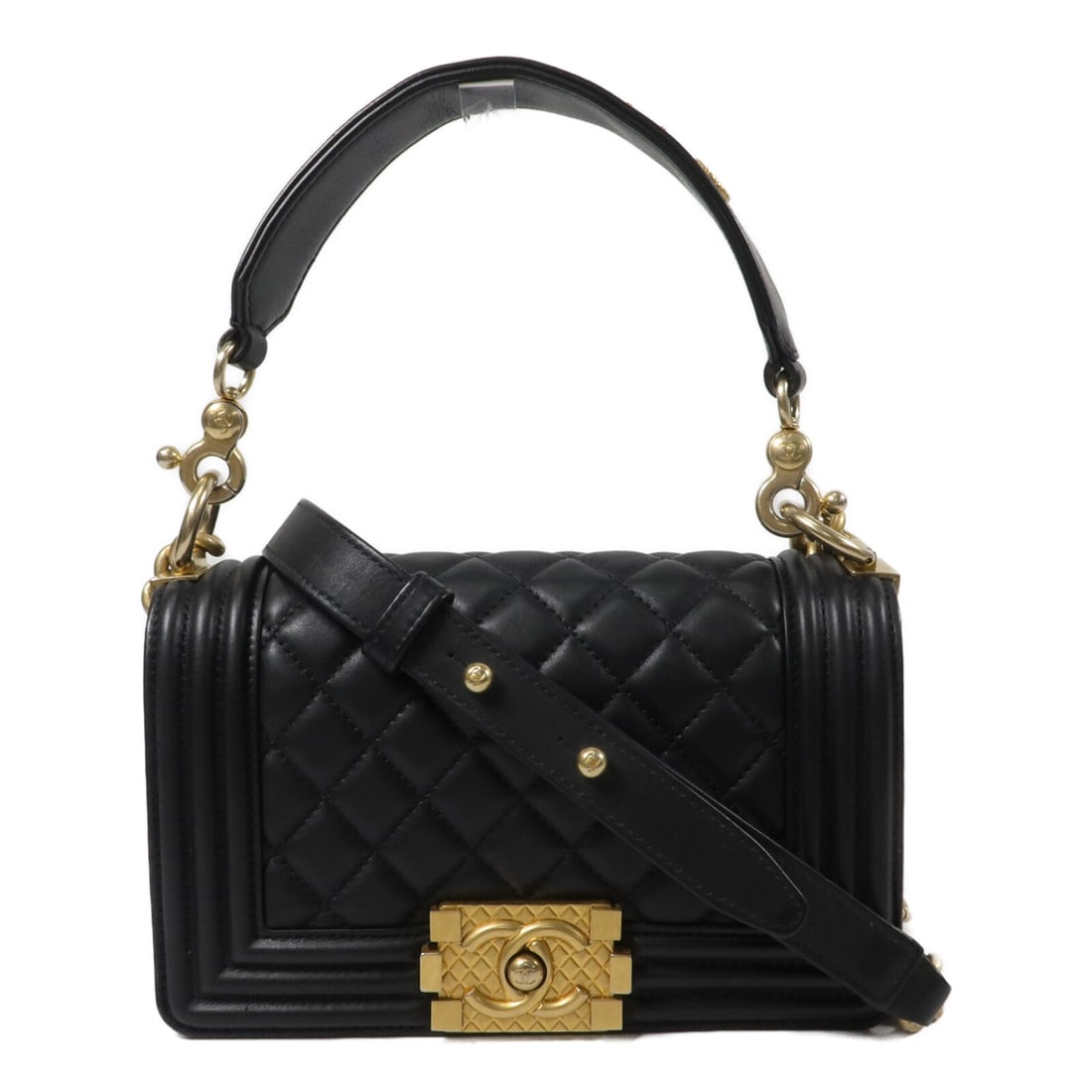 Chanel Boy 20 GHW Black Lambskin 2Way: Black Boy 20 2-way chain shoulder bag with CC GHW in Lambskin (sheep leather). Includes hologram sticker, guarantee, and shoulder strap. 20 x 12 x 5 cm; handle 30 cm; shoulder 68-117 cm. Model AS21117