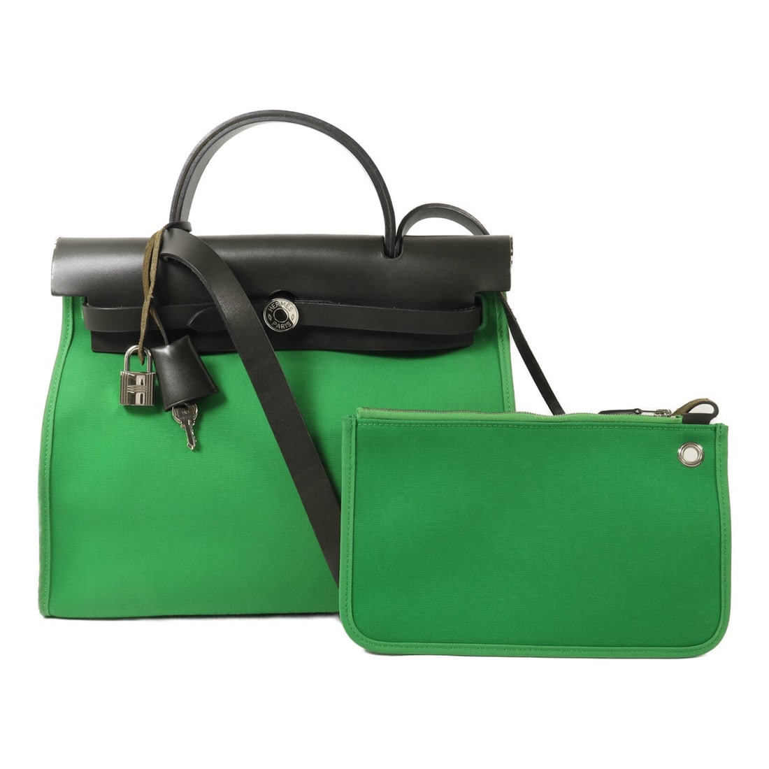 Hermes Herbag PM 2Way Cactus Khaki Canvas: Cactus and khaki Herbag PM 2-way shoulder bag in canvas. Includes clochette, key, cadena, and pouch. 30 x 24 x 11 cm; handle 23 cm; shoulder up to 98 cm.