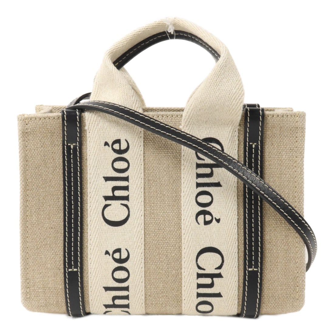 Chloe Woody Nano 2 Way Beige Black: Woody Nano 2 way shoulder bag in beige and black canvas. Size: W19.5 x H14 x D6 cm. Handle 20 cm. Shoulder 112 cm.