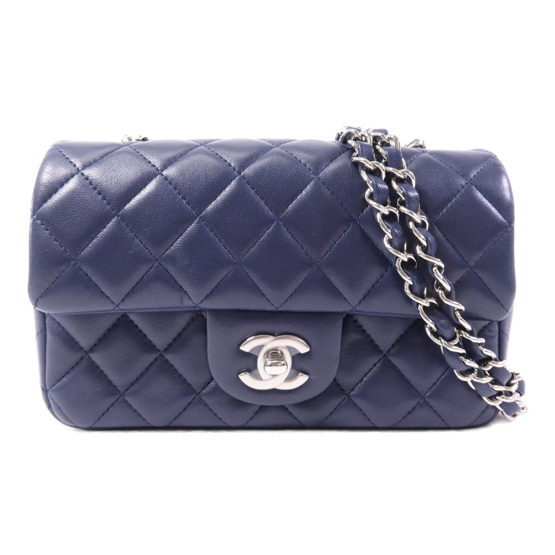 Chanel CC SHW Mini Classic 20 Navy: CC SHW Mini Classic 20 chain shoulder bag in navy lambskin. Size: W20 x H12 x D6 cm. Shoulder 112 cm. Includes hologram sticker and guarantee.