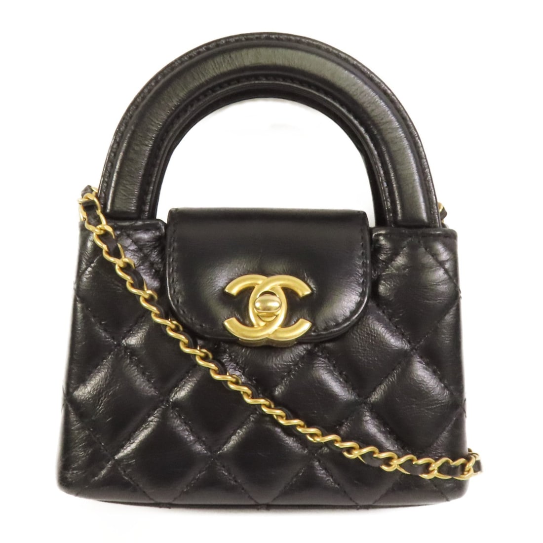 Chanel CC Kelly Nano 2 Way Black: CC Kelly Nano 2 way shoulder bag in black calfskin. Size: W12 x H8.5 x D4.5 cm. Handle 17 cm. Shoulder 118 cm. Includes storage box, storage bags, and hologram sticker.