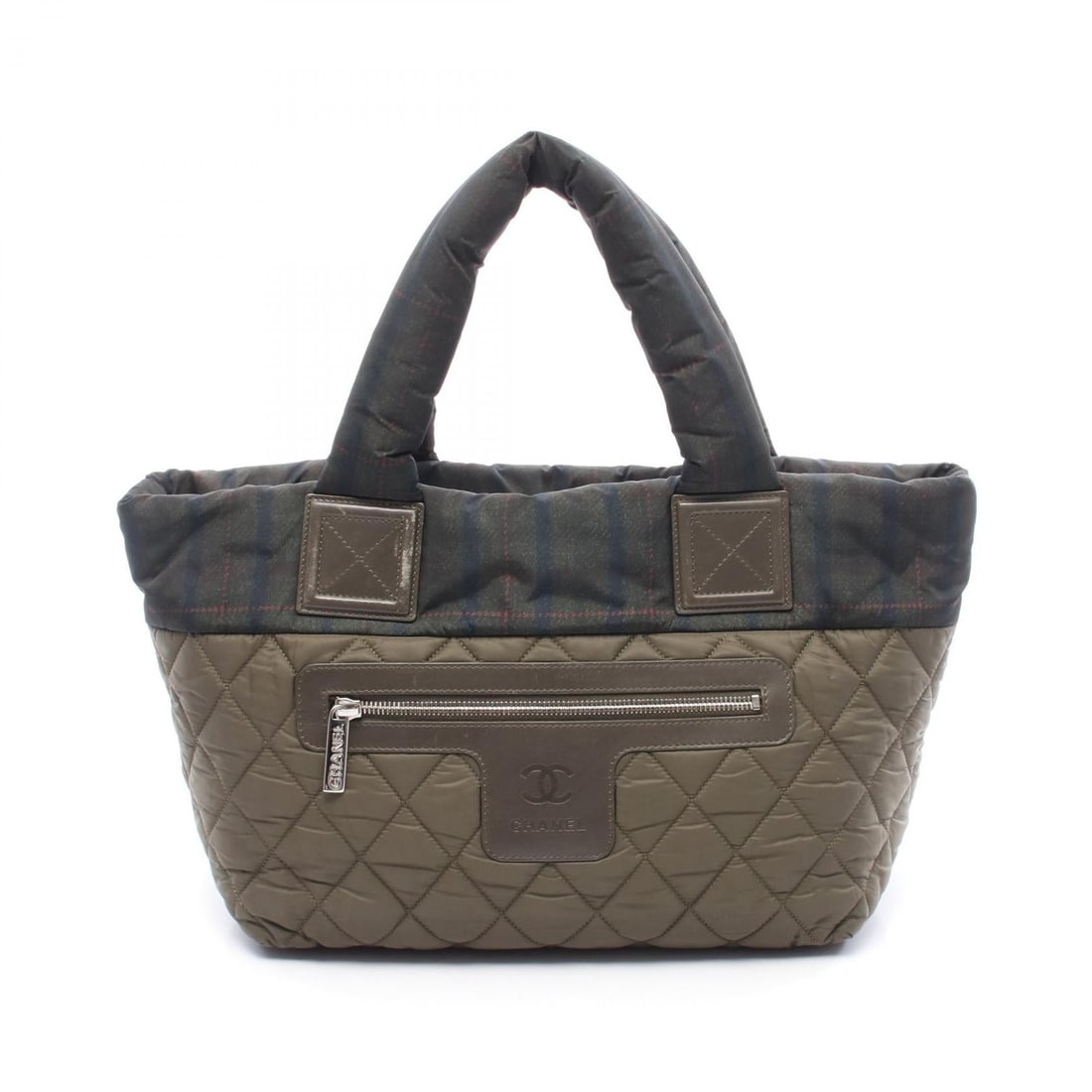 Chanel Coco Cocoon Small Khaki: Khaki, green, and multicolor COCO Cocoon Small tote bag in nylon and leather with SHW. No accessories. 28 x 23 x 15 cm. Handle 36 cm.