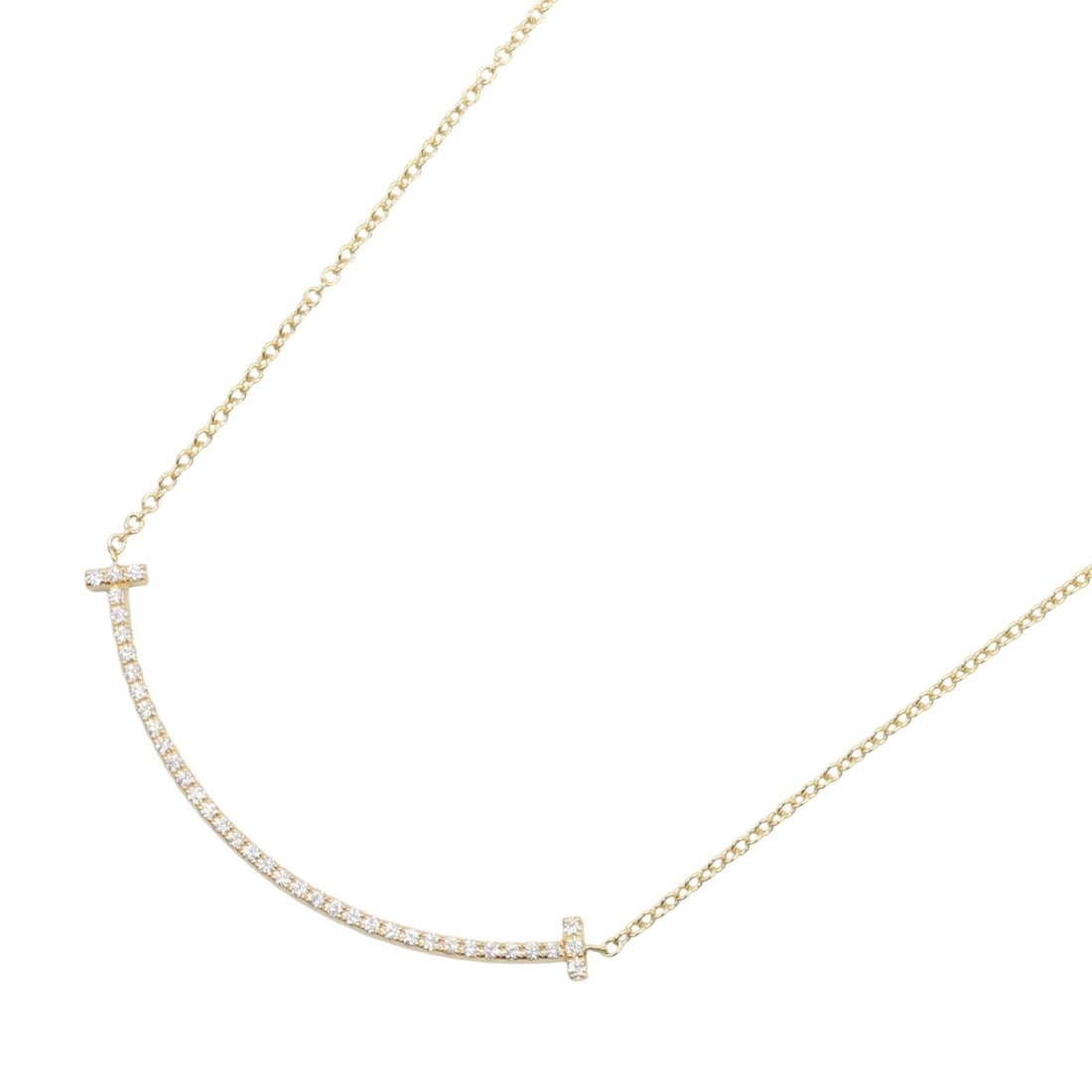 Tiffany T Smile Small Diamond Gold: T Smile Small diamond necklace in K18 yellow gold with diamond. Neck size 40.5cm. Motif 37mm wide x 3mm high. Weight 2.2g.