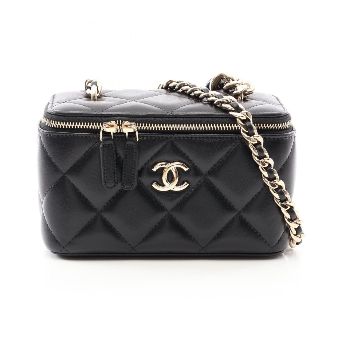 Chanel Vanity Black Lambskin: Black Matelasse Vanity bag in lambskin with combination hardware. No accessories. 16 x 9.5 x 7.5 cm. Shoulder 114.5 cm.