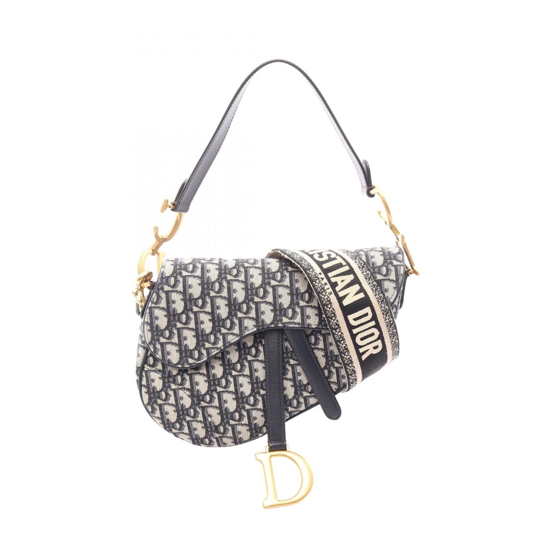 Dior Oblique Saddlebag 2Way: Beige and navy Saddlebag Oblique Jacquard 2-Way handbag in canvas and leather. Includes shoulder strap. 24 x 17 x 6 cm. Handle 52 cm. Shoulder 93 cm.