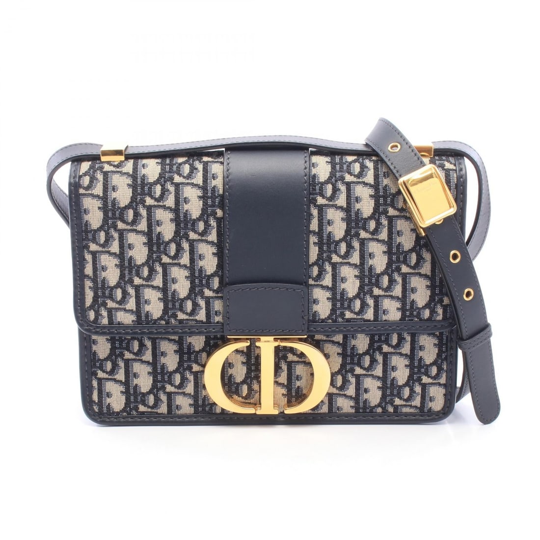 Dior 30 Montaigne Navy: Navy and beige 30 MONTAIGNE shoulder crossbody bag in canvas and leather. No accessories. 24 x 18 x 7 cm. Shoulder 108-118 cm.