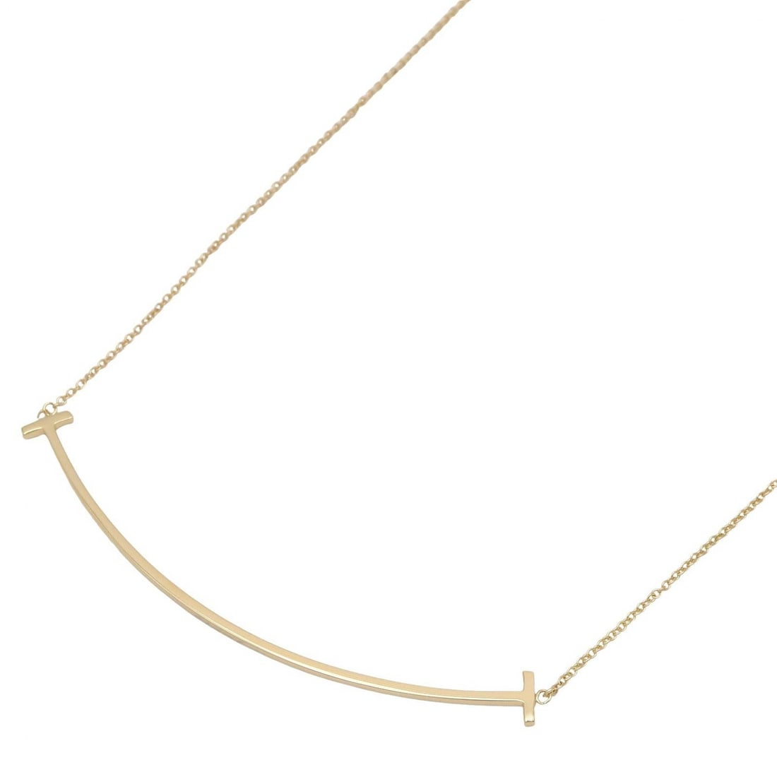 Tiffany T Smile Large Necklace Gold: T Smile Large necklace in K18 yellow gold. Neck size 40-45.5cm. Motif 68.5mm wide x 6mm high. Weight 3.8g.