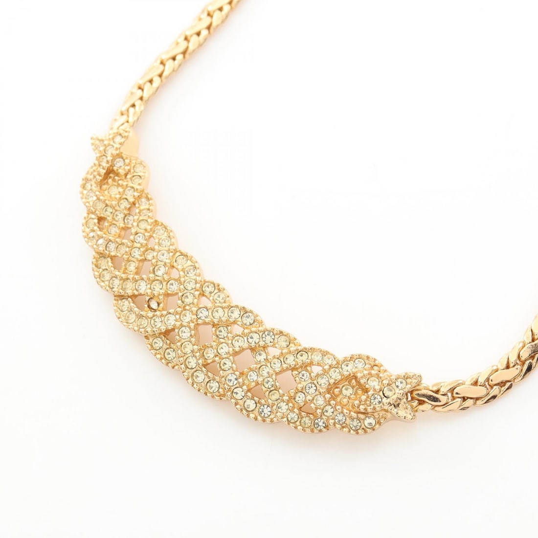 Dior Gold Rhinestone Necklace: Necklace in gold plated metal with rhinestone. Adjustable neck size 38-43cm. Motif 55mm wide x 25mm high.