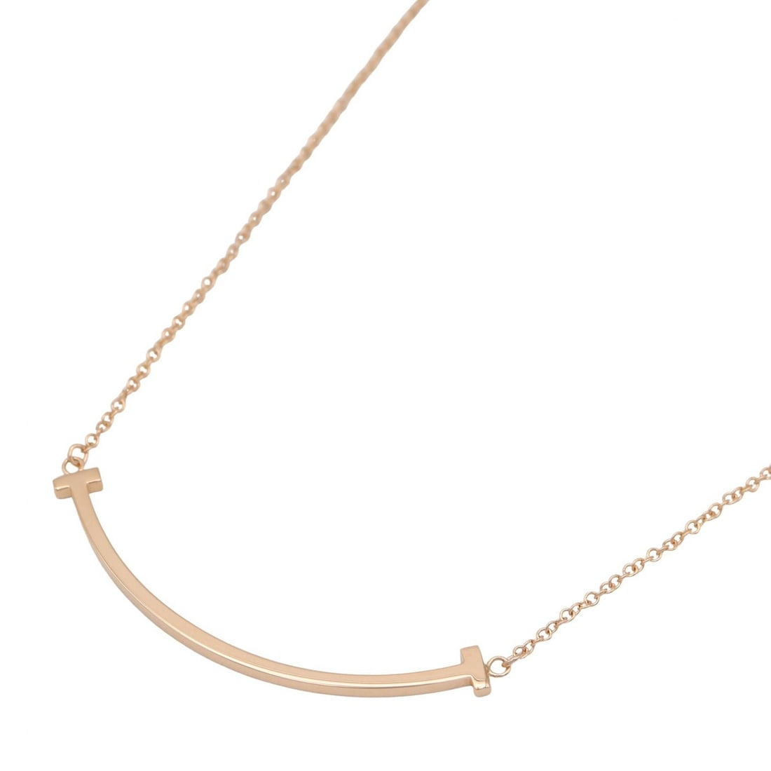 Tiffany T Smile Small Necklace K18PG: Gold T Smile Small necklace in K18PG rose gold. Adjustable neck size 40.5/45.5cm, motif 36.8mm x 3.5mm, weight 2.9g. Includes storage box.