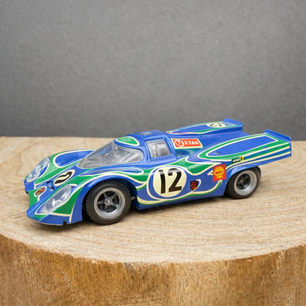 Modele Depose Porsche 917 Racing Model 1:43 Scale: Vintage 1:43 scale white metal Porsche 917 endurance racing model, finished in blue and green livery with #12 graphics and period-style sponsor decals. Underside marked Super Champion Porsche 917, Mod